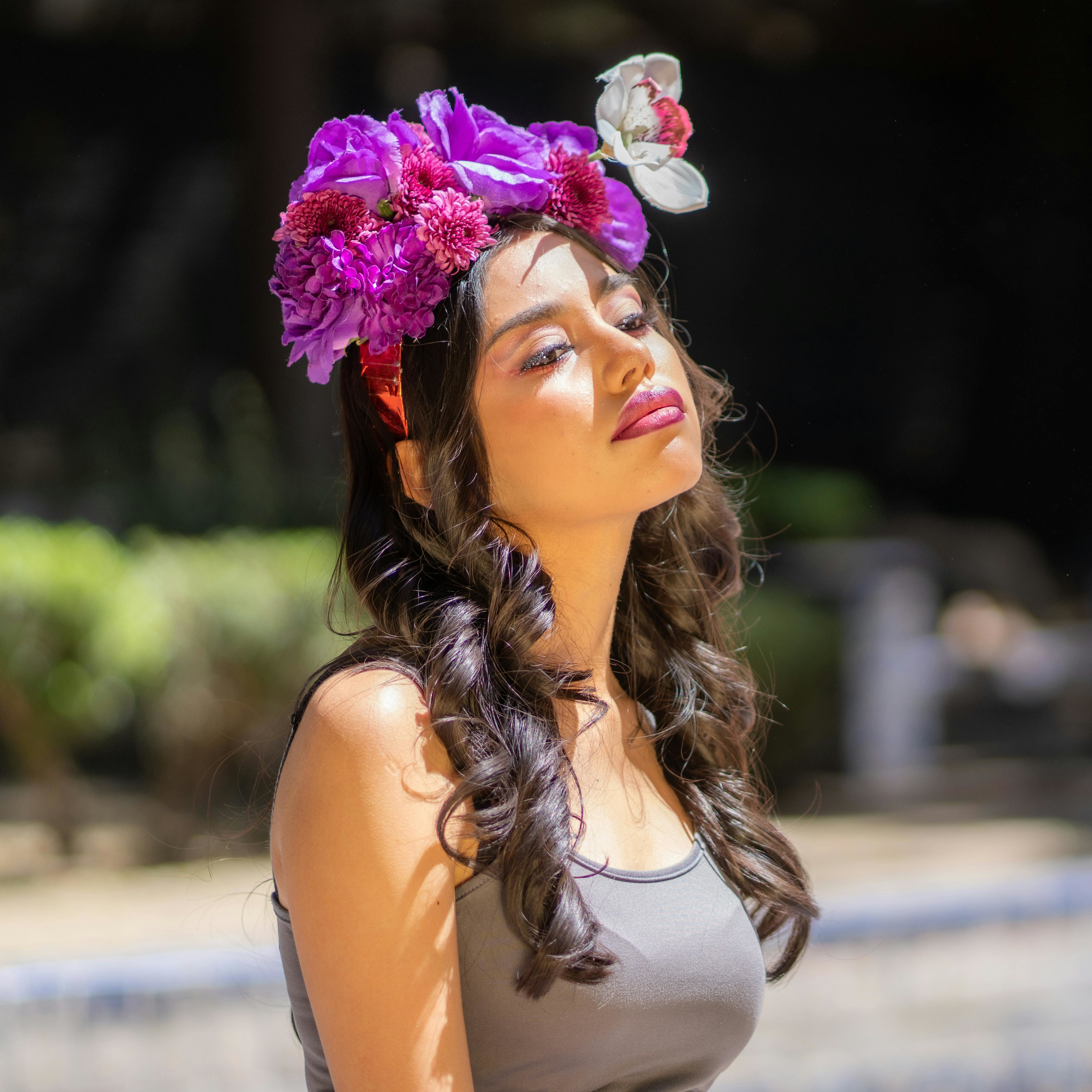 Latina model wearing a floral headpiece in a beauty editorial portrait